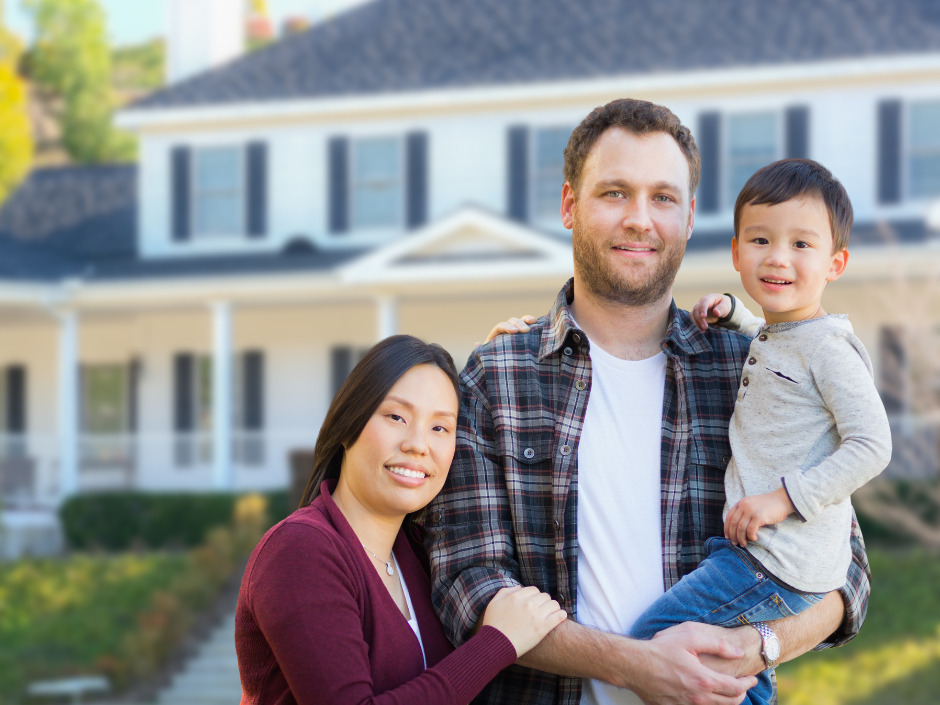 RMC Family Standing in Front of Home